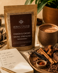 Herbal Cacao Chaga & Cacao package with a cup of cacao, ingredients, and a notebook on a rustic surface.