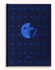Blue dream journal with moon and star design on a white background