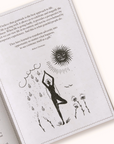 Open Gratitude Journal with black and white illustrations and text on a white background