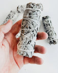 Holding a Herbal Smudge Stick
