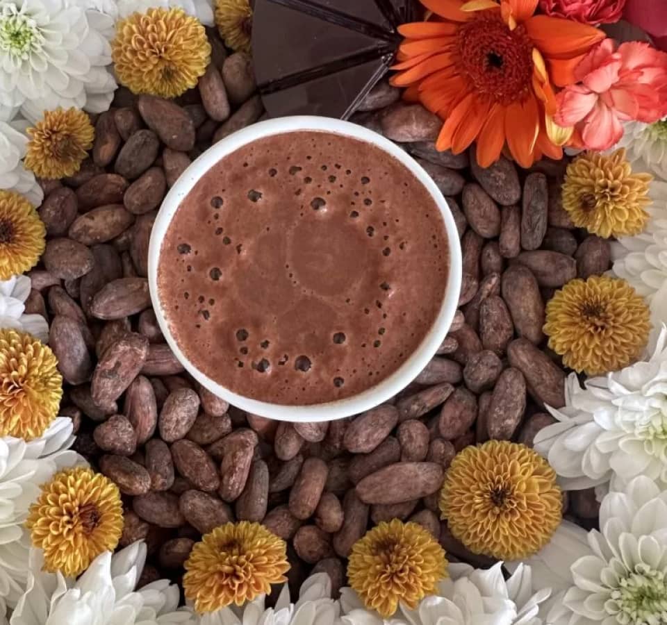 Organic ceremonial cacao chunks on rustic surface with earthy vibes
