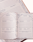 Open journal with questionnaire-style pages on a white background
