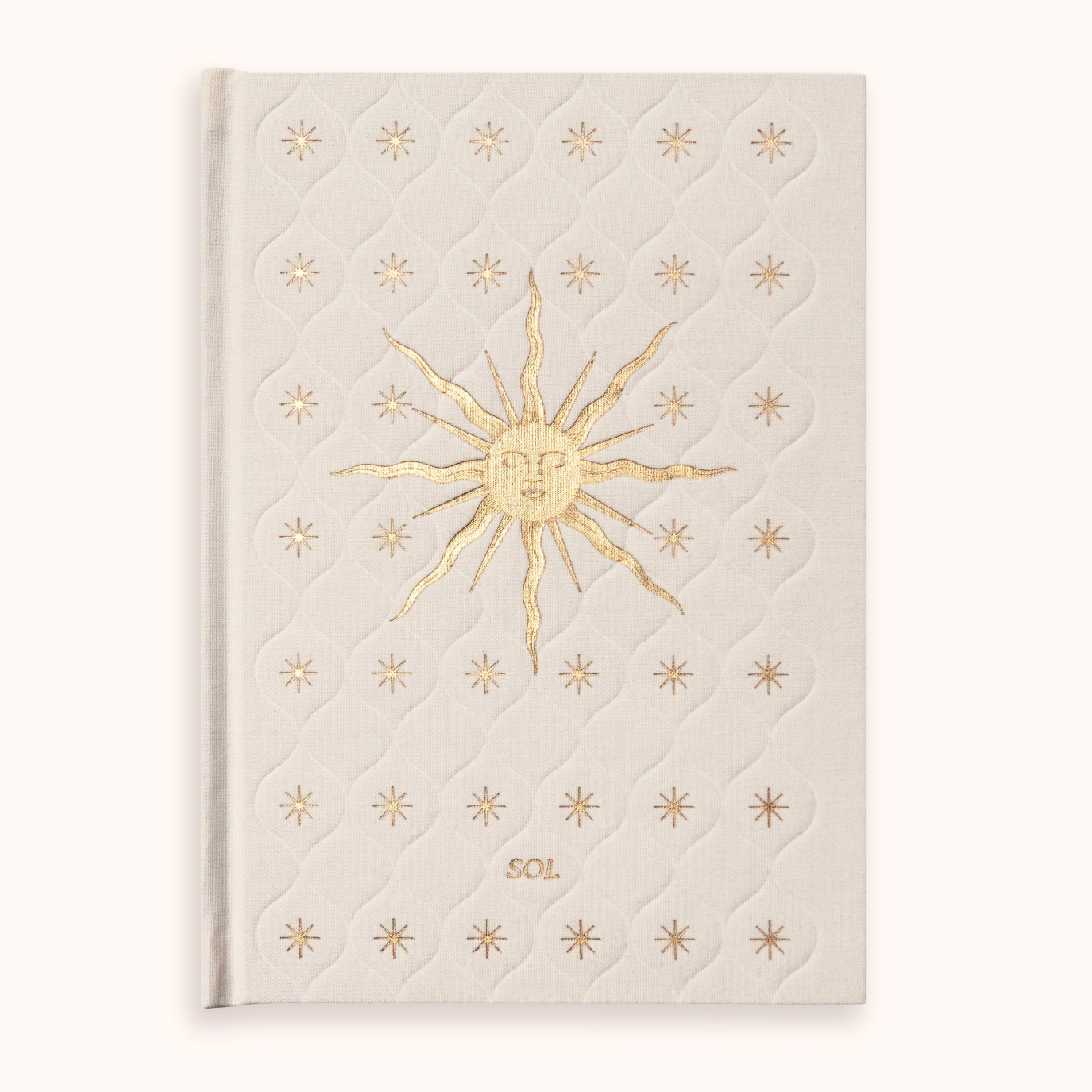 Cream-colored Gratitude Journal with gold sun design and 'SOL' text on a white background