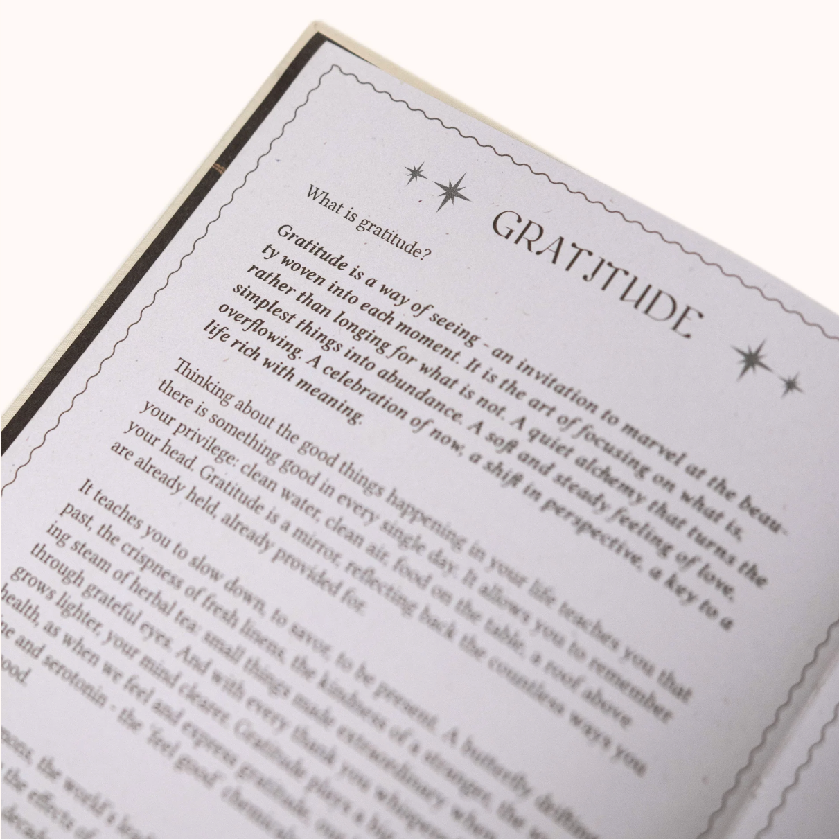 Open Gratitude Journal with a page titled 'Gratitude' on a white background