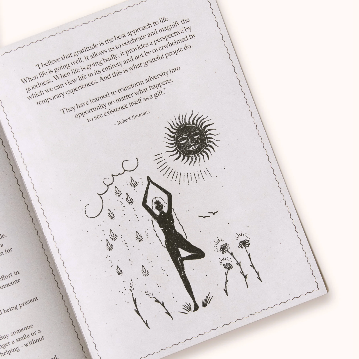 Open Gratitude Journal with black and white illustrations and text on a white background