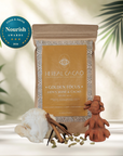 Herbal Cacao 'Golden Focus' lion's mane and cacao, styled with a Nourish Awards 2026 badge, cinnamon sticks, a lionsmane mushroom, on a light surface with tropical leaves in the background.