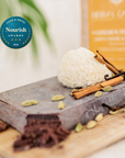 Herbal Cacao 'Golden Focus' ceremonial cacao with a Lion's Mane and Cacao blend, shown with a dried lion's mane mushroom, a cinnamon stick, and cardamom on a white background with a 2026 Food & Drive Awards badge.
