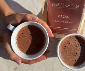 holding herbal cacao in sun